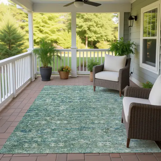 Teal Blue And Ivory Ikat Washable Indoor Outdoor Area Rug Photo 9