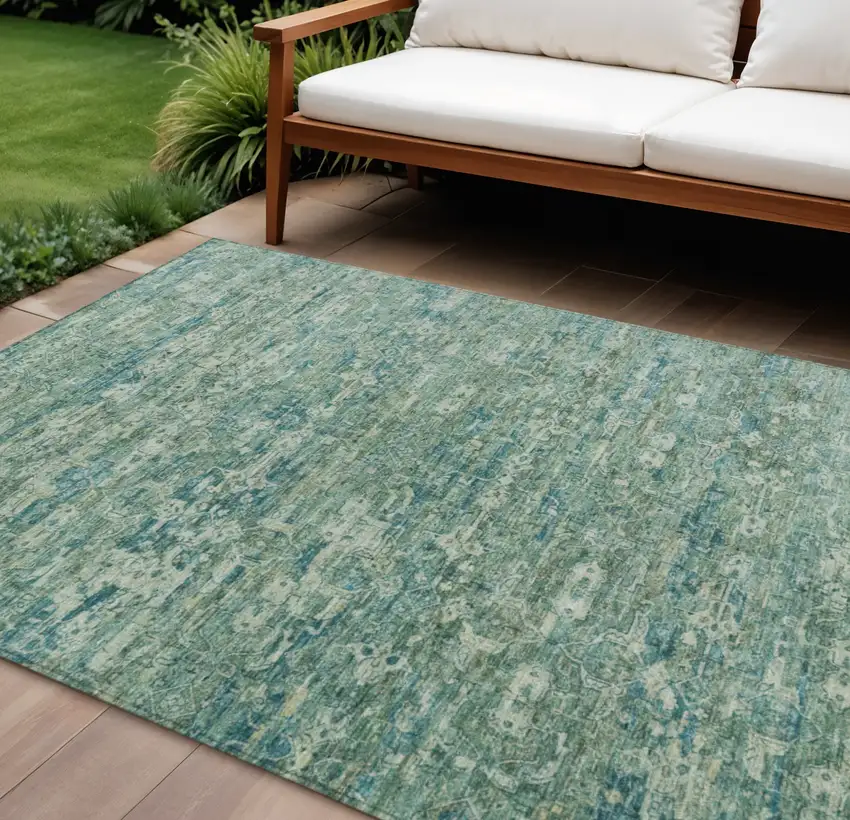 Teal Blue And Ivory Ikat Washable Indoor Outdoor Area Rug Photo 1