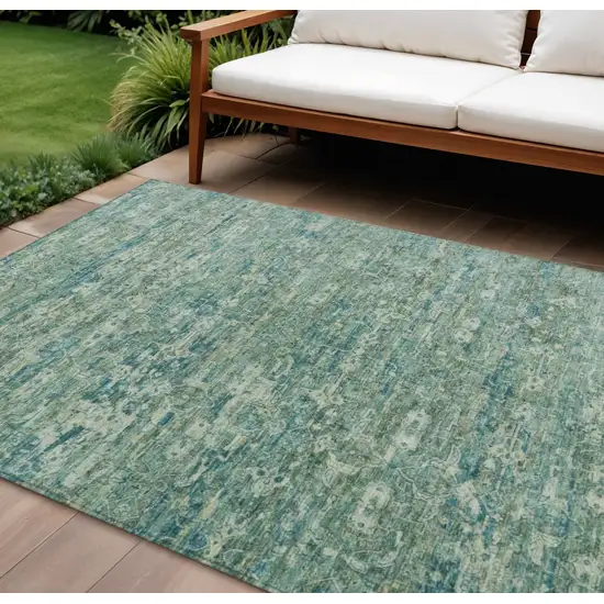 Teal Blue And Ivory Ikat Washable Indoor Outdoor Area Rug Photo 1