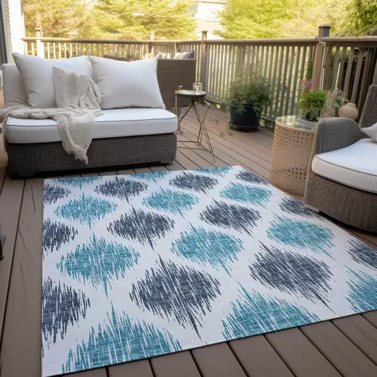 Teal Blue And Ivory Ikat Washable Indoor Outdoor Area Rug Photo 8