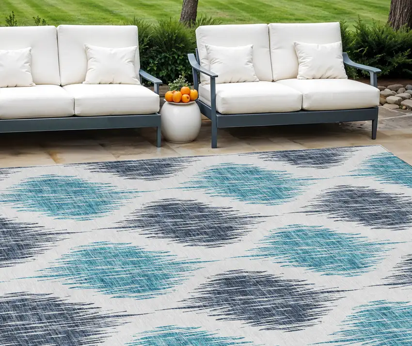 Teal Blue And Ivory Ikat Washable Indoor Outdoor Area Rug Photo 1