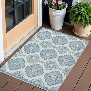Photo of Teal Blue And Ivory Medallion Washable Indoor Outdoor Area Rug