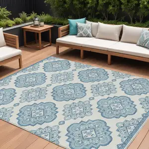 Photo of Teal Blue And Ivory Medallion Washable Indoor Outdoor Area Rug