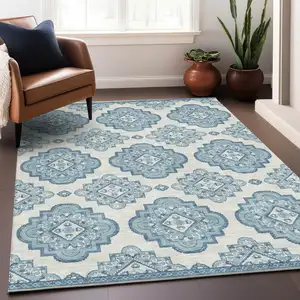Photo of Teal Blue And Ivory Medallion Washable Indoor Outdoor Area Rug