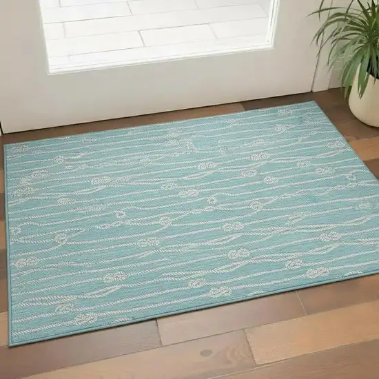 Teal Blue And Ivory Nautical Washable Area Rug With UV Protection Photo 1