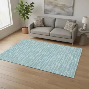 Photo of Teal Blue And Ivory Nautical Washable Area Rug With UV Protection