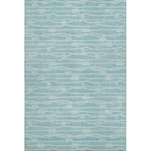 Photo of Teal Blue And Ivory Nautical Washable Area Rug With UV Protection