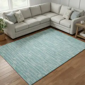 Photo of Teal Blue And Ivory Nautical Washable Area Rug With UV Protection