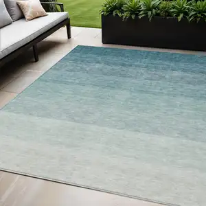 Photo of Teal Blue And Ivory Ombre Washable Indoor Outdoor Area Rug