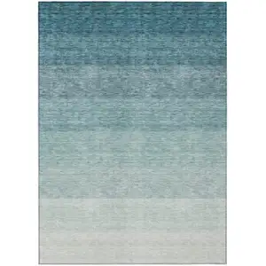 Photo of Teal Blue And Ivory Ombre Washable Indoor Outdoor Area Rug