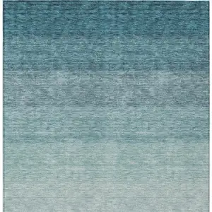 Photo of Teal Blue And Ivory Ombre Washable Indoor Outdoor Area Rug