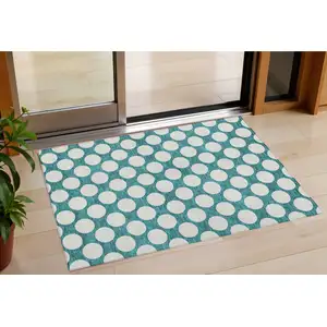 Photo of Teal Blue And Ivory Polka Dot Washable Indoor Outdoor Area Rug