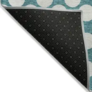 Photo of Teal Blue And Ivory Polka Dot Washable Indoor Outdoor Area Rug