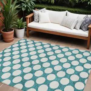 Photo of Teal Blue And Ivory Polka Dot Washable Indoor Outdoor Area Rug
