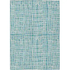 Photo of Teal Blue And Ivory Striped Washable Indoor Outdoor Area Rug