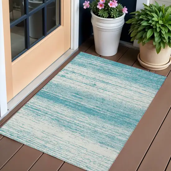 Teal Blue And Ivory Striped Washable Indoor Outdoor Area Rug Photo 1