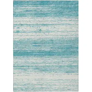 Photo of Teal Blue And Ivory Striped Washable Indoor Outdoor Area Rug