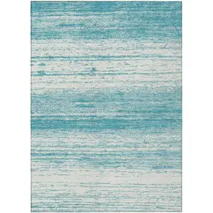 Photo of Teal Blue And Ivory Striped Washable Indoor Outdoor Area Rug