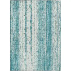 Photo of Teal Blue And Ivory Striped Washable Indoor Outdoor Area Rug