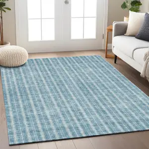 Photo of Teal Blue And Ivory Striped Washable Indoor Outdoor Area Rug