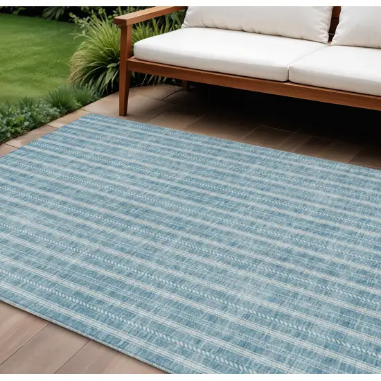 Teal Blue And Ivory Striped Washable Indoor Outdoor Area Rug Photo 1