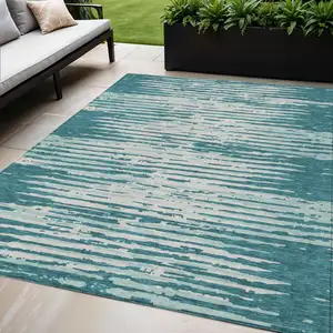 Photo of Teal Blue And Ivory Striped Washable Indoor Outdoor Area Rug