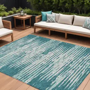 Photo of Teal Blue And Ivory Striped Washable Indoor Outdoor Area Rug
