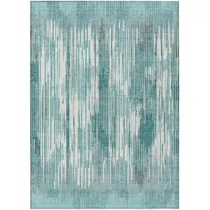 Photo of Teal Blue And Ivory Striped Washable Indoor Outdoor Area Rug