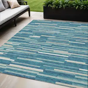 Photo of Teal Blue And Ivory Striped Washable Indoor Outdoor Area Rug