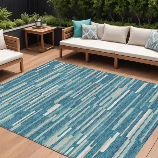 Teal Blue And Ivory Striped Washable Indoor Outdoor Area Rug Photo 1
