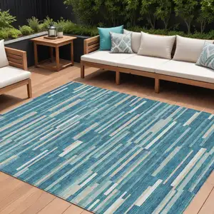 Photo of Teal Blue And Ivory Striped Washable Indoor Outdoor Area Rug