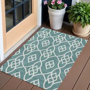 Photo of Teal Blue And Ivory Trellis Washable Indoor Outdoor Area Rug