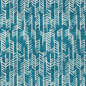 Photo of Teal Blue And Ivory Tribal Washable Indoor Outdoor Area Rug