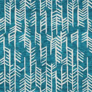 Photo of Teal Blue And Ivory Tribal Washable Indoor Outdoor Area Rug