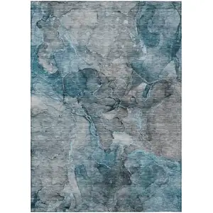 Photo of Teal Blue And Navy Blue Abstract Washable Indoor Outdoor Area Rug