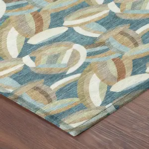 Photo of Teal Blue And Orange Abstract Washable Indoor Outdoor Area Rug