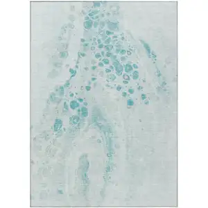 Photo of Teal Blue And Pale Aqua Abstract Washable Indoor Outdoor Area Rug