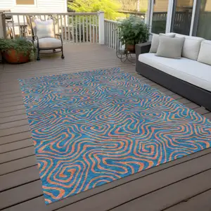 Photo of Teal Blue And Pink Abstract Washable Indoor Outdoor Area Rug