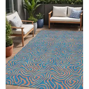 Photo of Teal Blue And Pink Abstract Washable Indoor Outdoor Area Rug