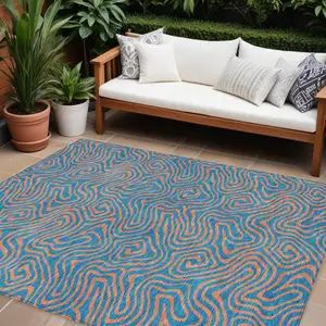 Photo of Teal Blue And Pink Abstract Washable Indoor Outdoor Area Rug