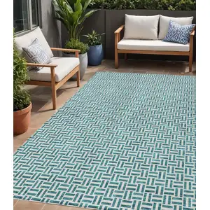 Photo of Teal Blue And Silver Geometric Washable Indoor Outdoor Area Rug