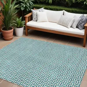 Photo of Teal Blue And Silver Geometric Washable Indoor Outdoor Area Rug
