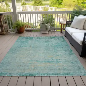 Photo of Teal Blue And Wheat Abstract Washable Indoor Outdoor Area Rug