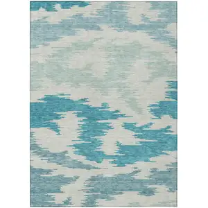 Photo of Teal Blue Aqua And Ivory Abstract Washable Indoor Outdoor Area Rug
