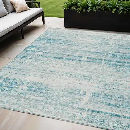Teal Blue Aqua And Ivory Abstract Washable Indoor Outdoor Area Rug Photo 1