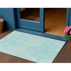Photo of Teal Blue Aqua And Ivory Floral Washable Indoor Outdoor Area Rug