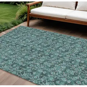 Photo of Teal Blue Aqua And Ivory Floral Washable Indoor Outdoor Area Rug