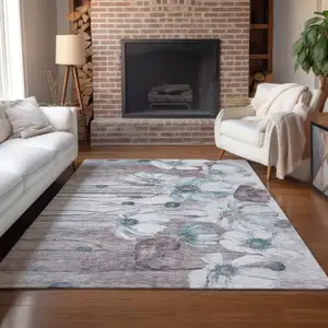 Photo of Teal Blue Aqua And Ivory Floral Washable Indoor Outdoor Area Rug