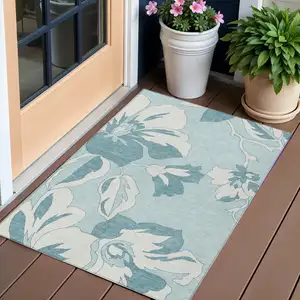 Photo of Teal Blue Aqua And Ivory Floral Washable Indoor Outdoor Area Rug