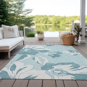 Photo of Teal Blue Aqua And Ivory Floral Washable Indoor Outdoor Area Rug